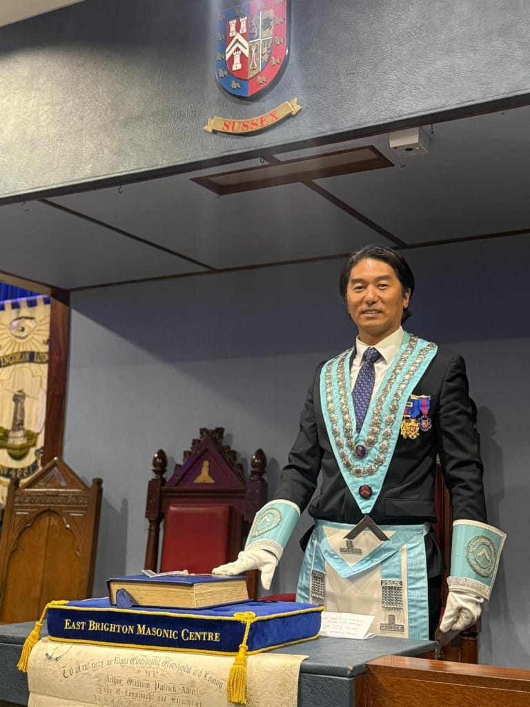W.Bro. Chuck Li standing in the lodge room at East Brighton Masonic Centre